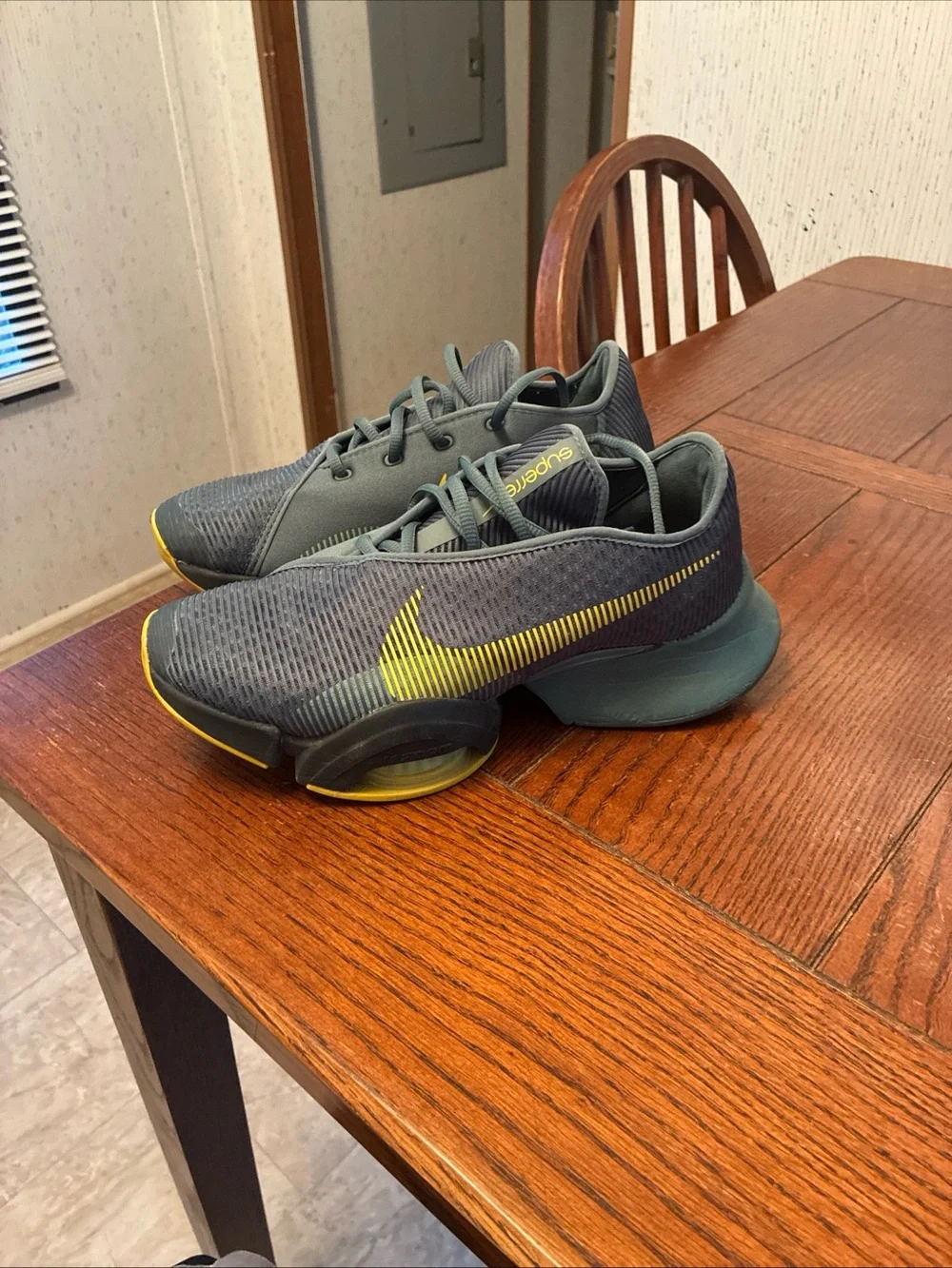 Nike Men’s Gray Athletic Shoes with Yellow Swoosh